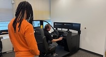 A person using a driver simulator